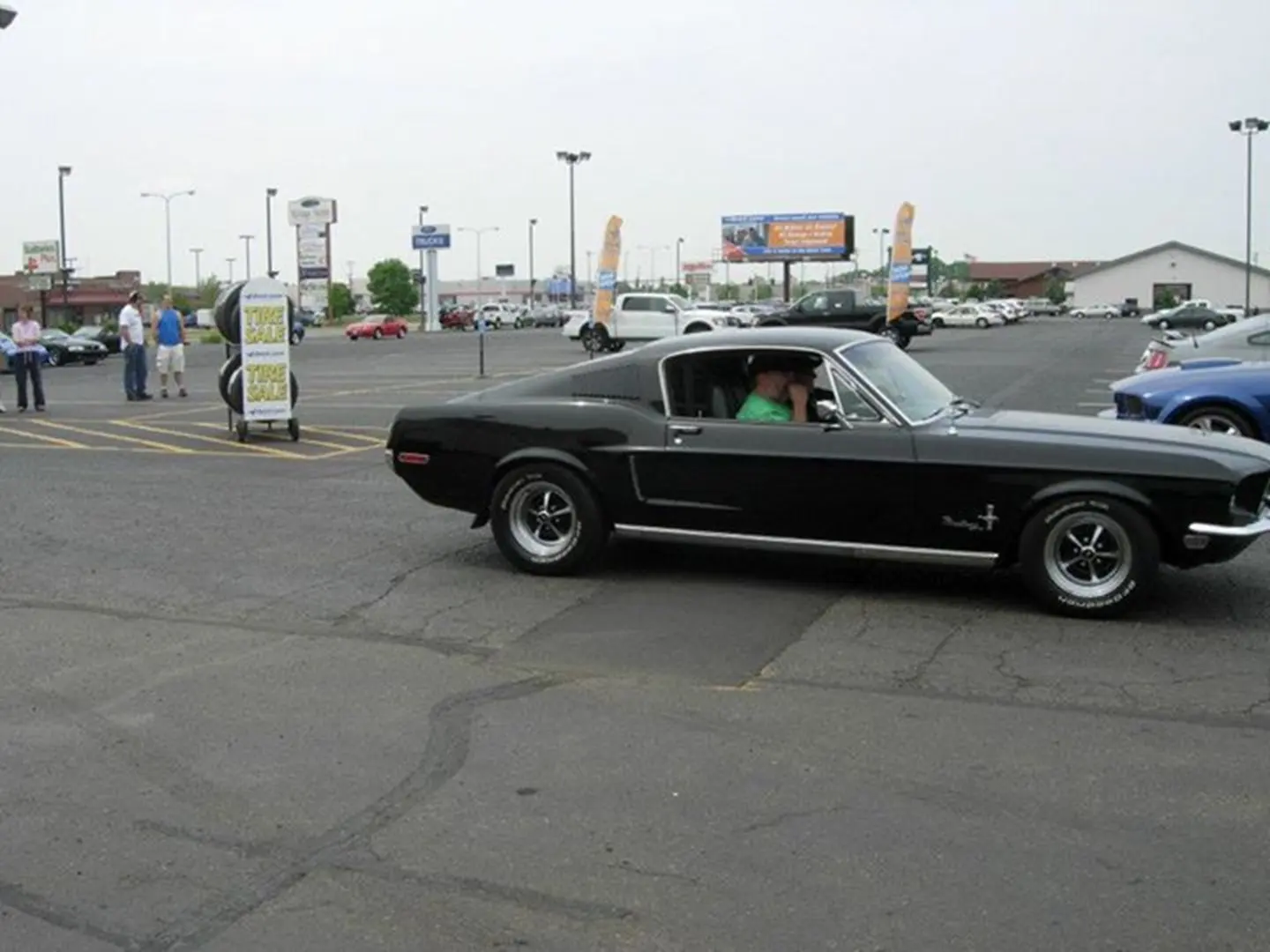 Vintage vehicle driving in lot
