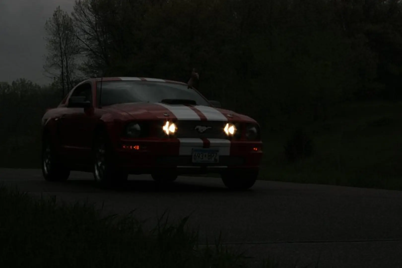 Sporty vehicle driving at night