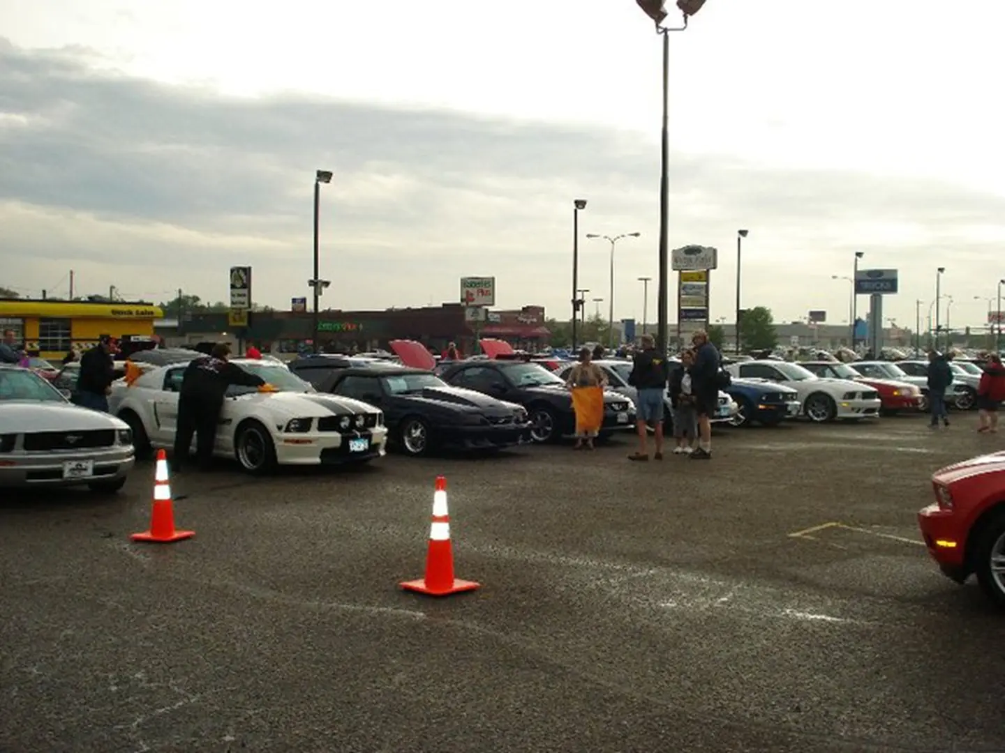 Car enthusiasts gather at parking lot