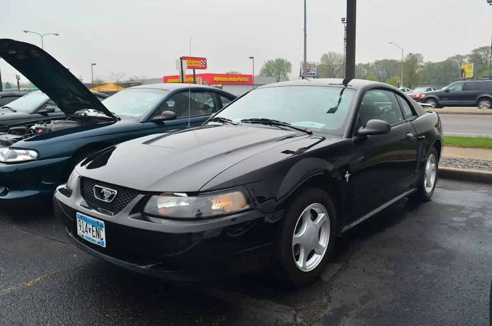 Shiny black coupe with emblem