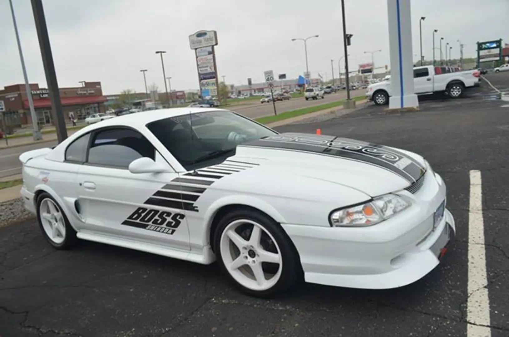 Modified white car with black stripe design