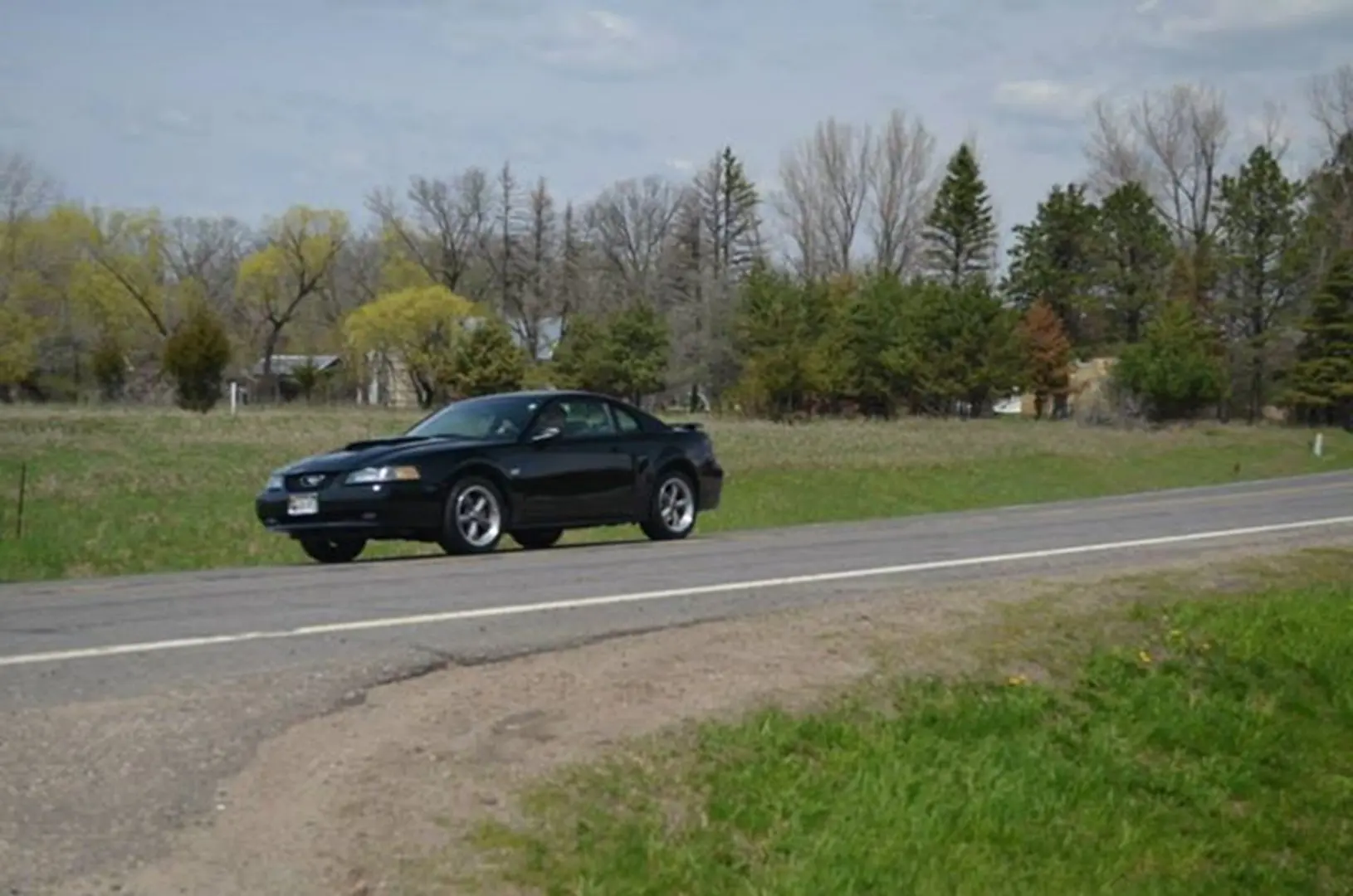Black car on countryside road