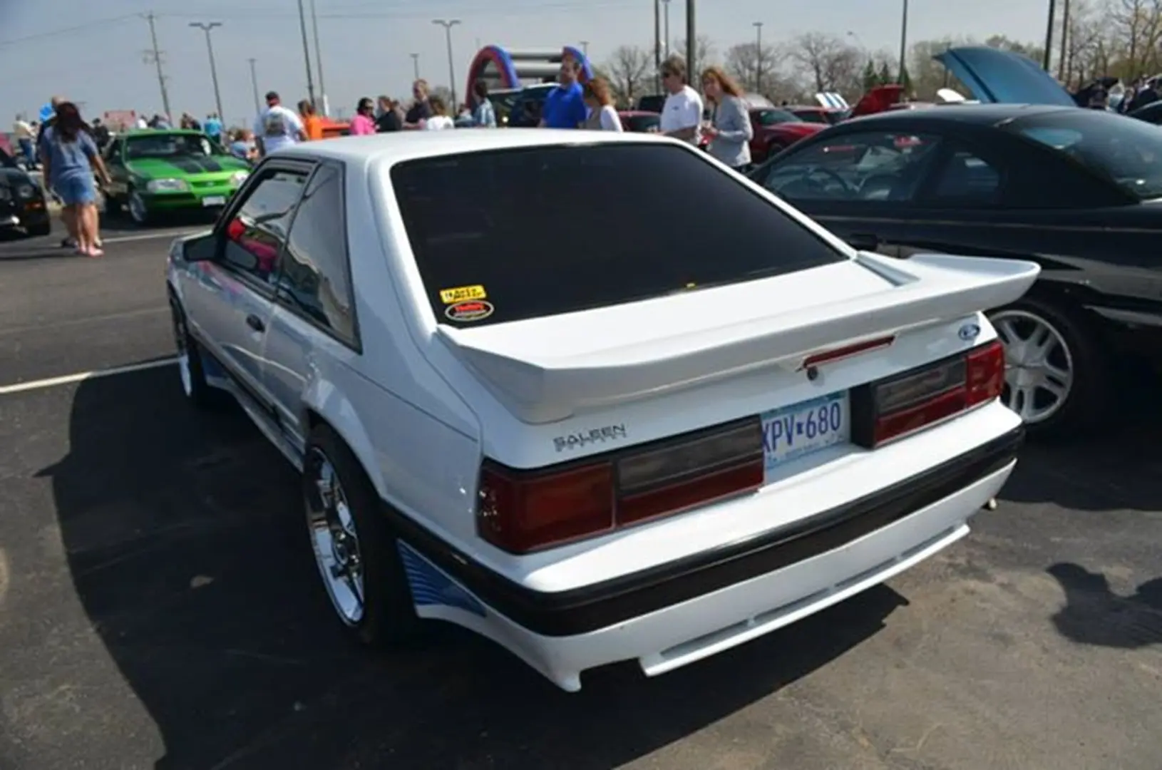 White classic car at outdoor car show