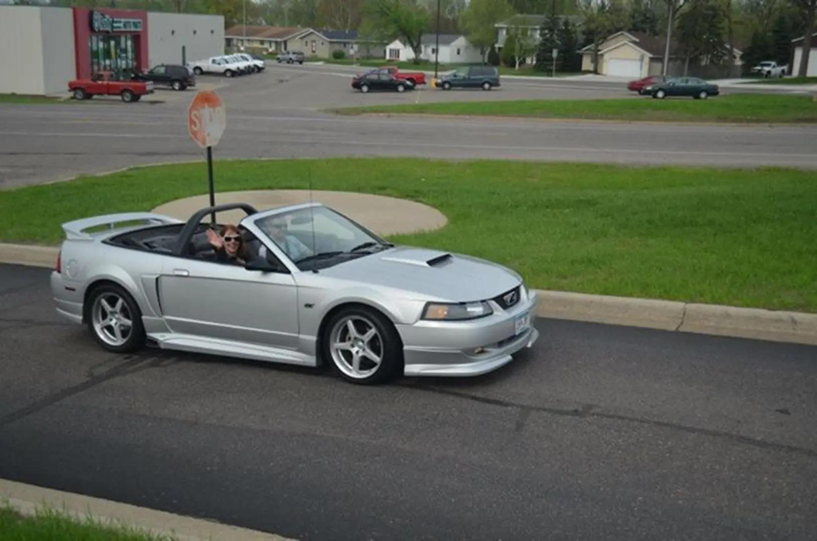 Convertible car with top down on street