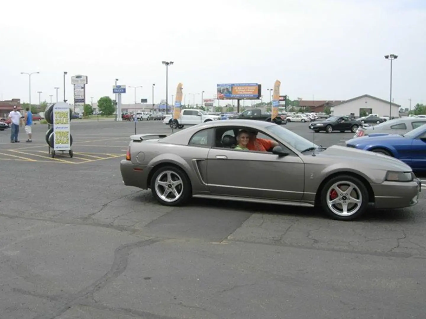 Urban parking lot with silver car