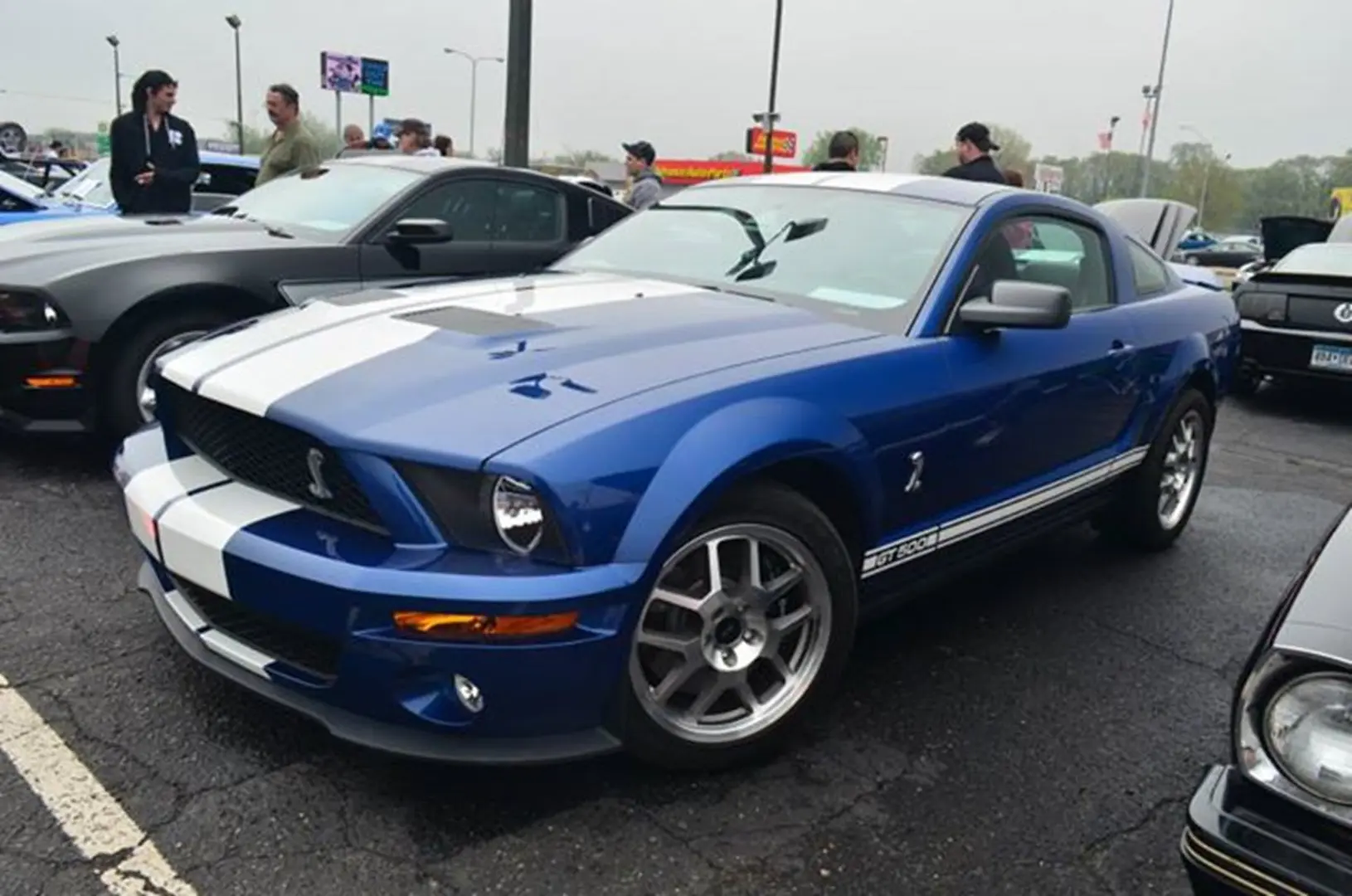 Blue sports car at a car show