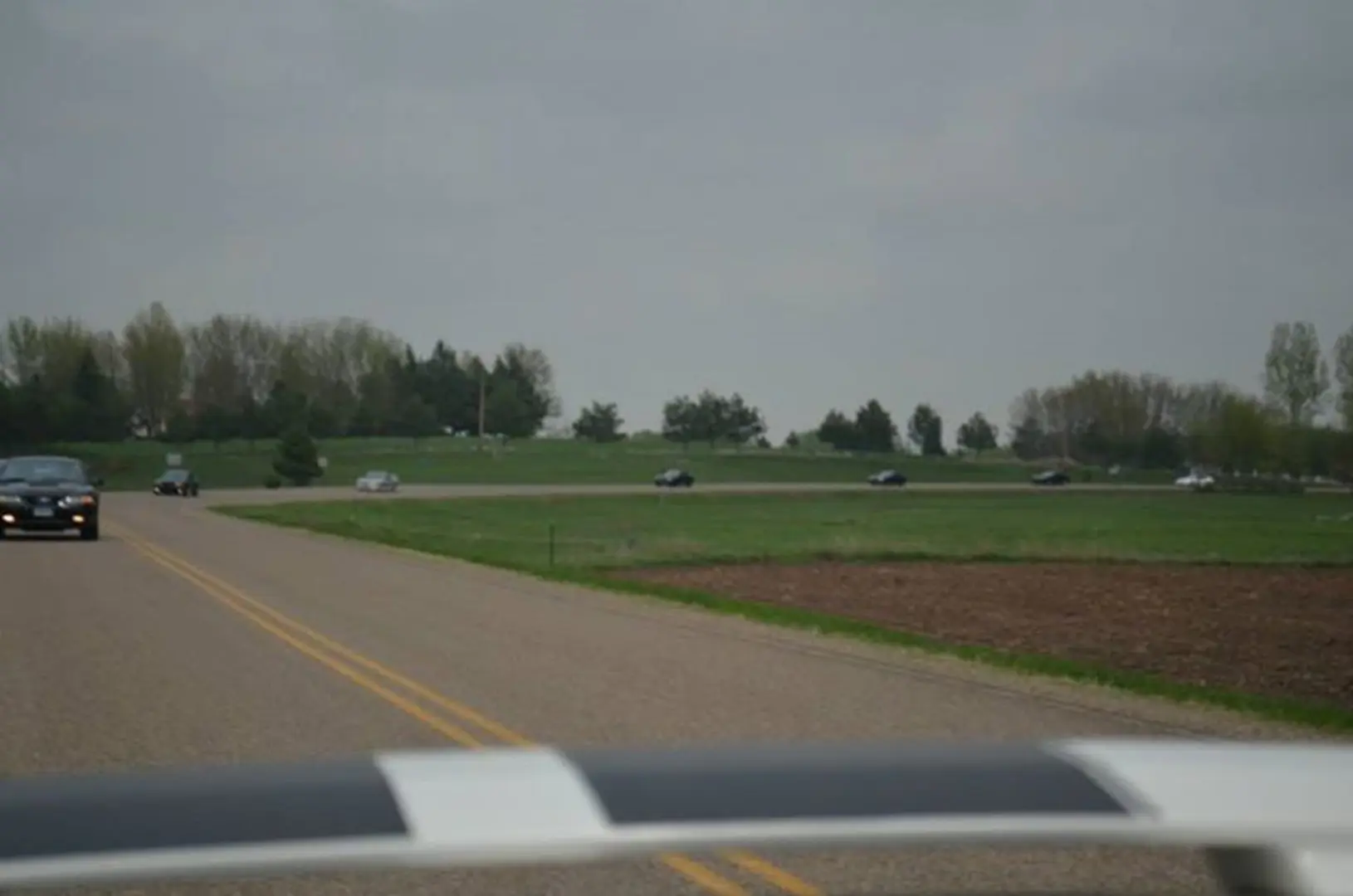 Vehicles on winding countryside road
