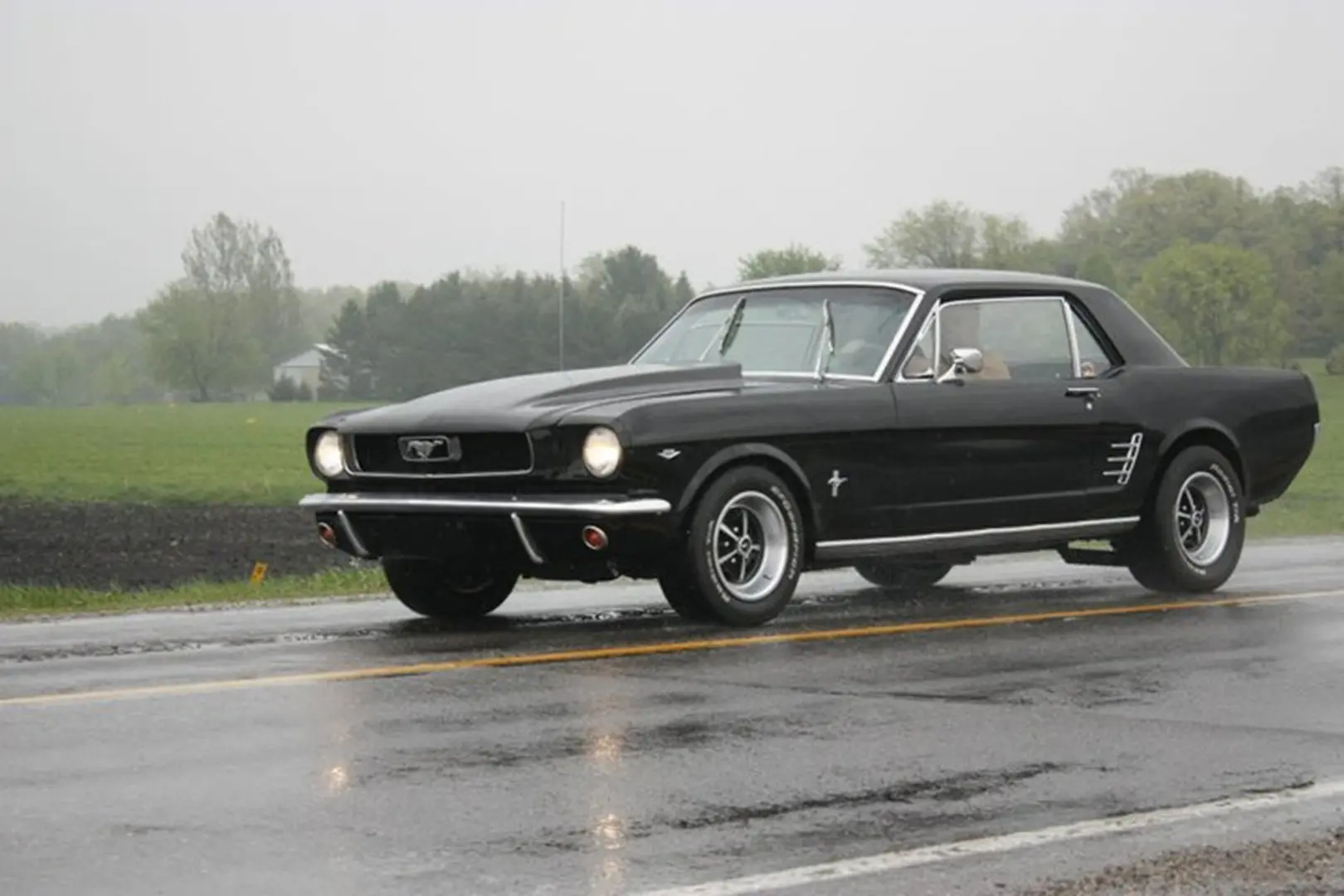 Retro vehicle on wet pavement