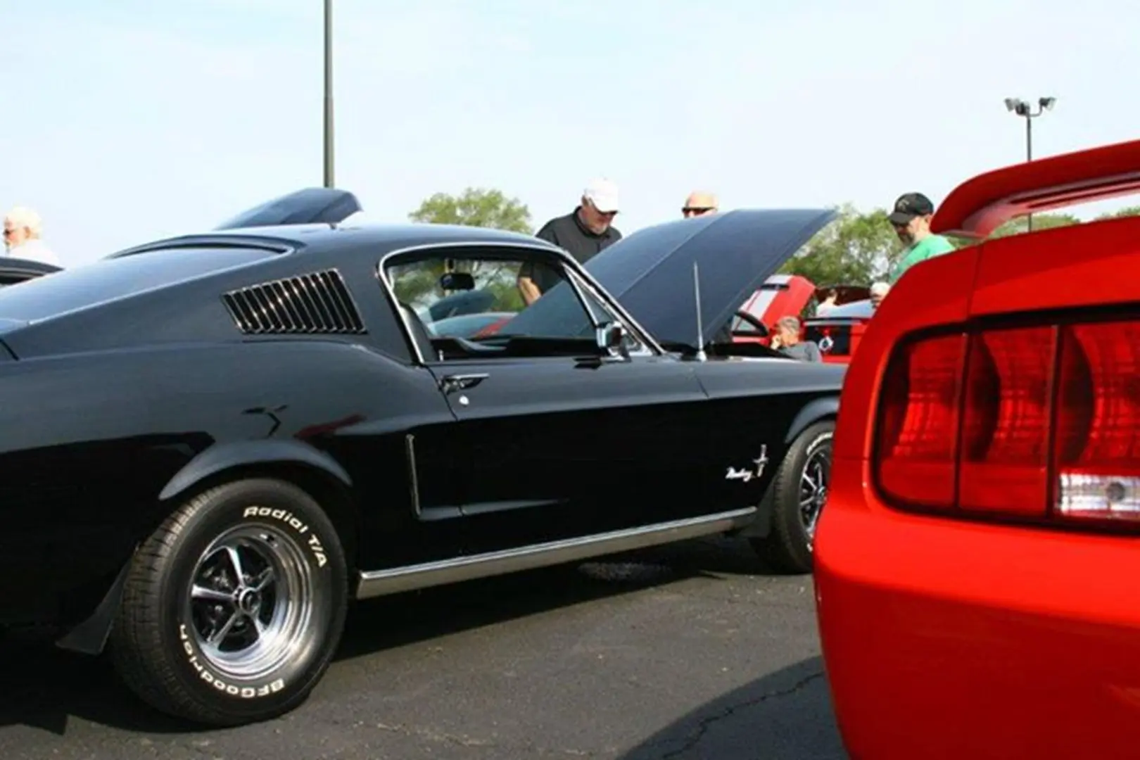Classic car show with red car