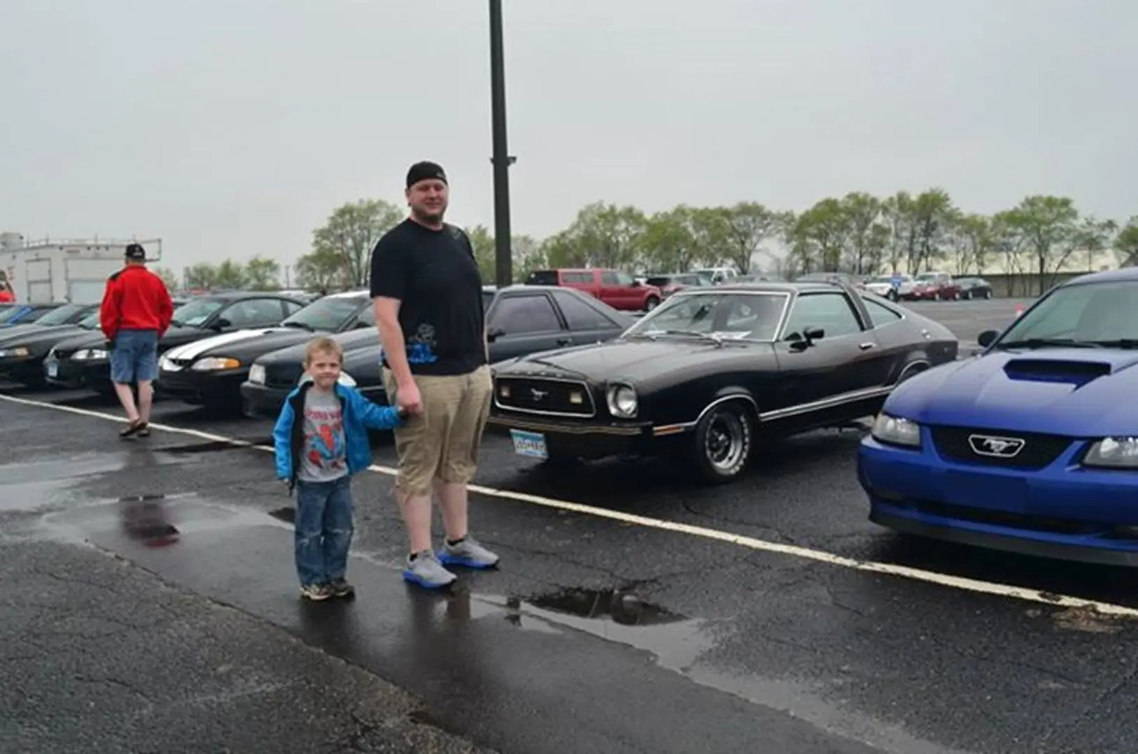Classic and modern cars parked in row