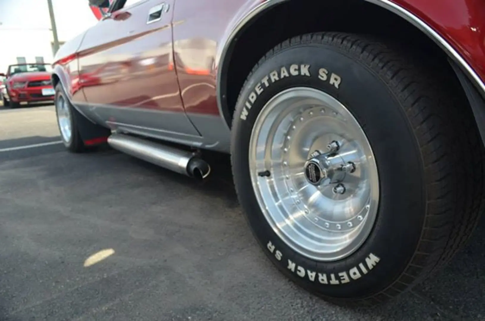 Side view of red vintage vehicle