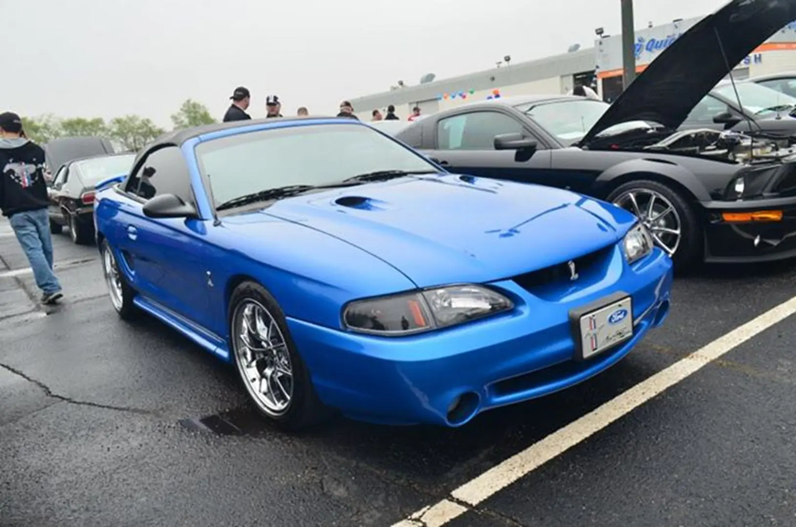 Shiny blue car with chrome wheels