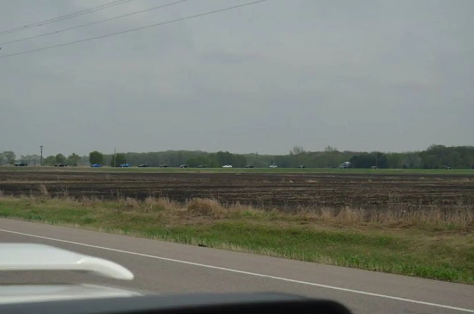 Rural road beside plowed field