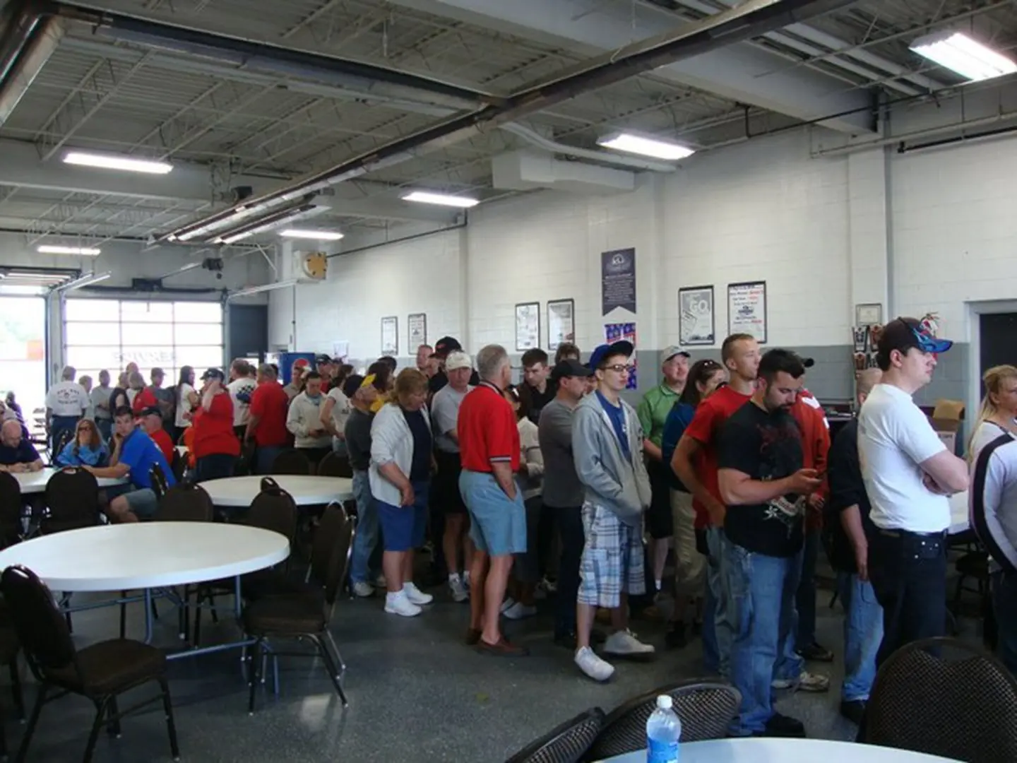 Crowd queued in a large room