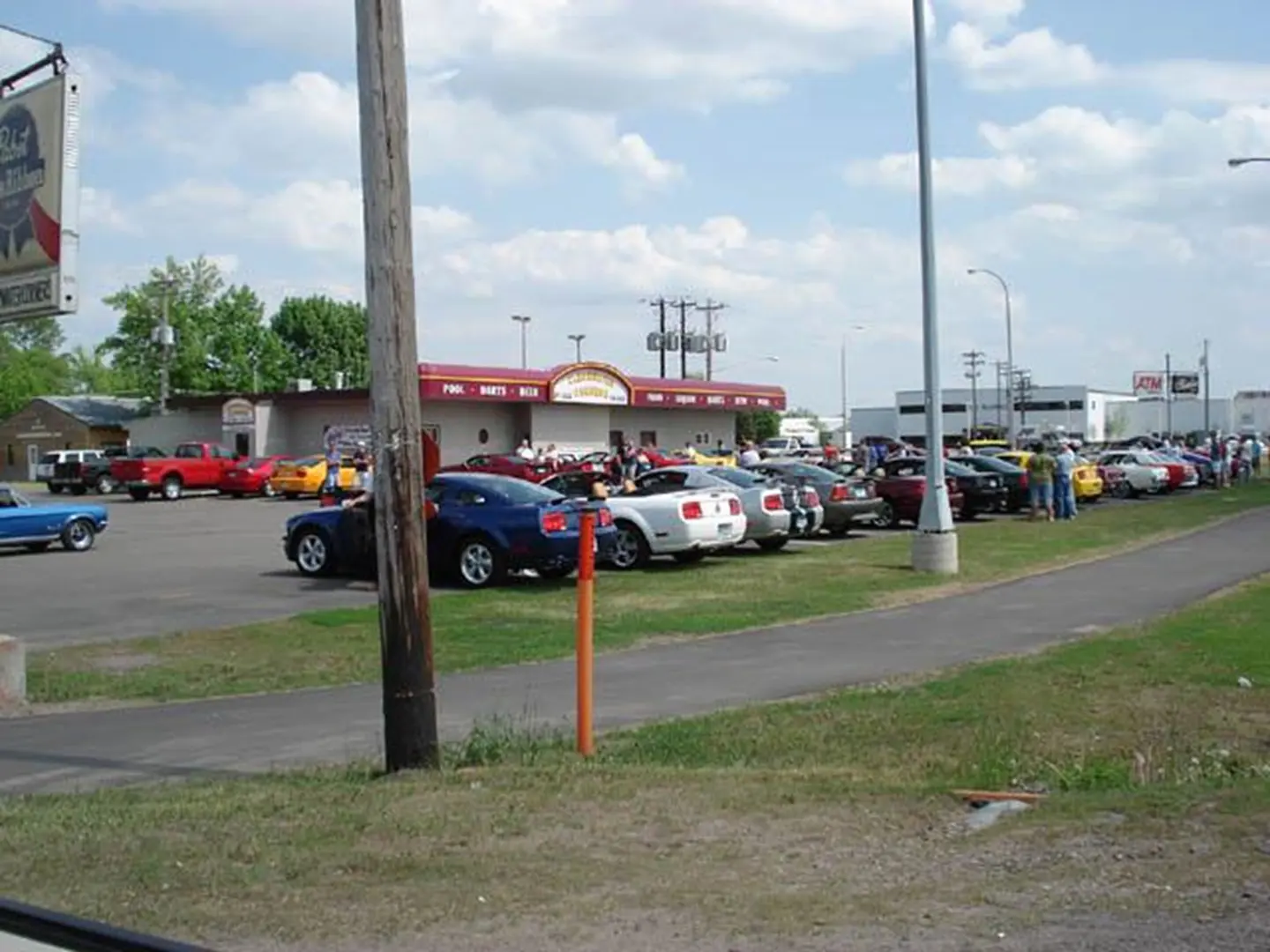 Classic cars parked outside a diner