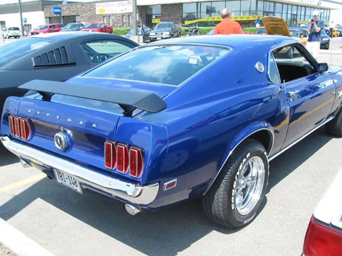 Shiny blue sports car in parking lot