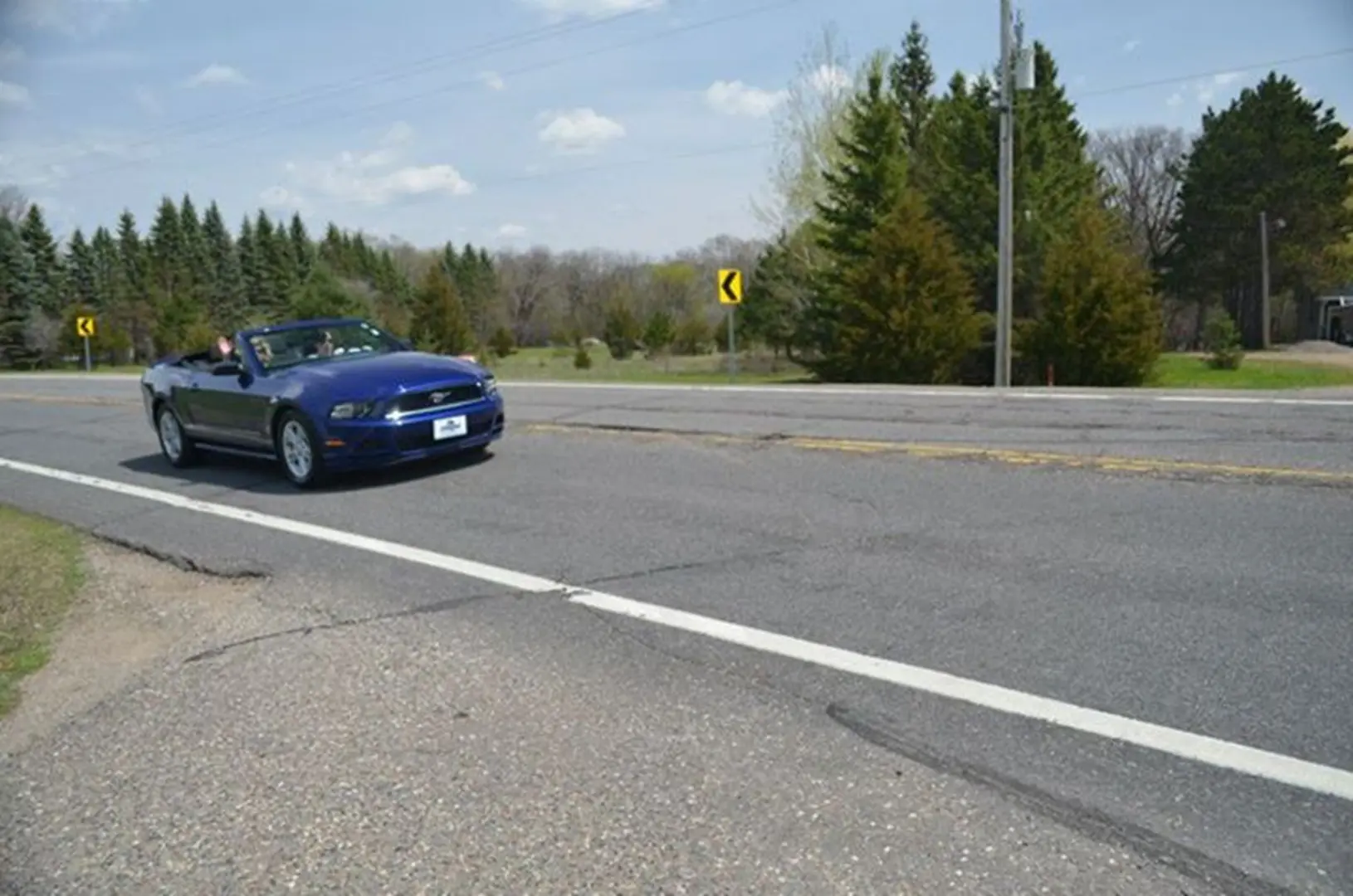 Convertible cruising on sunny day