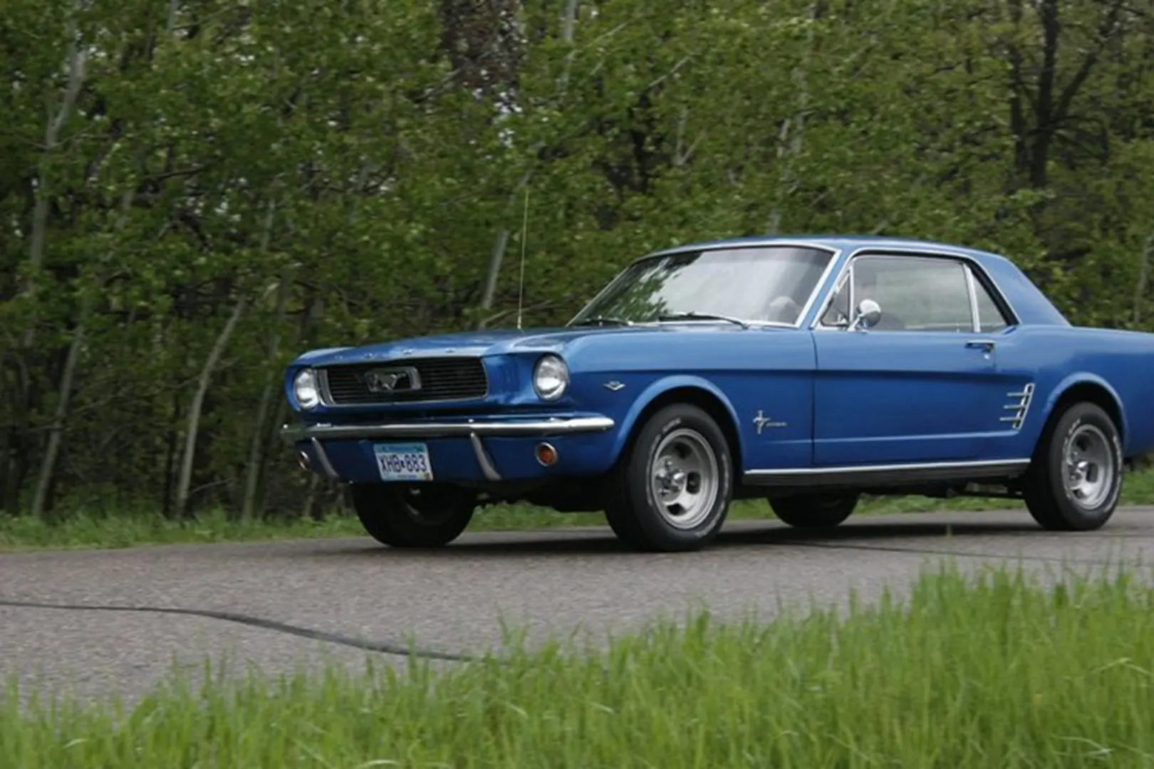 Retro blue vehicle on scenic route