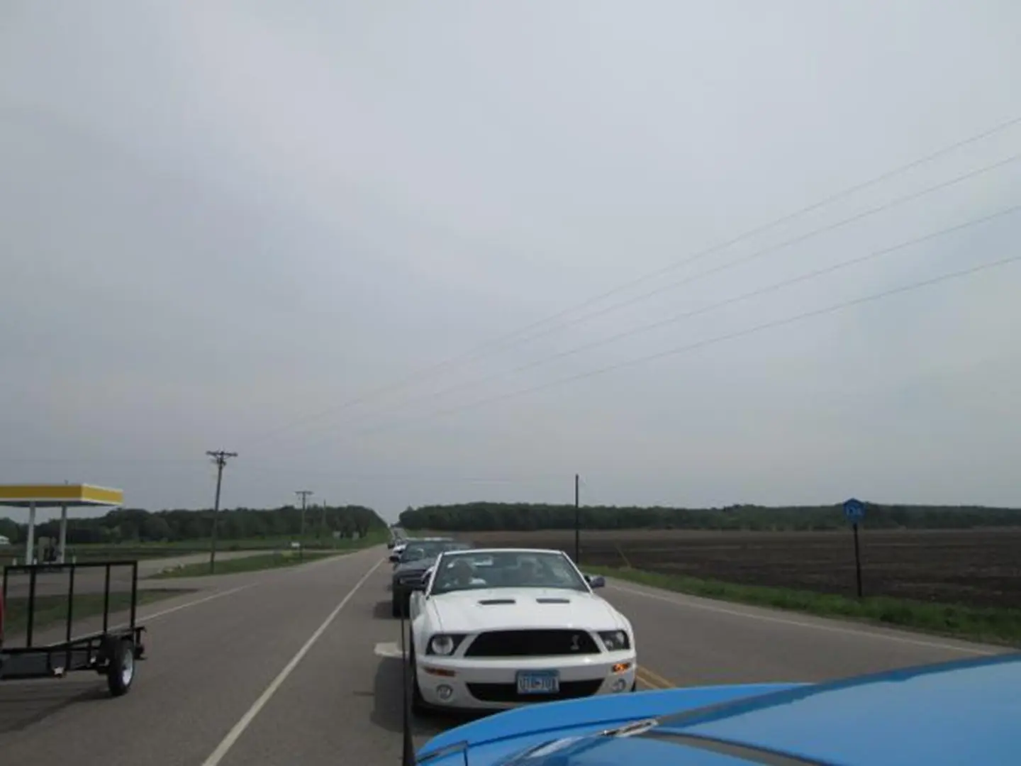 Cars lined up on rural road