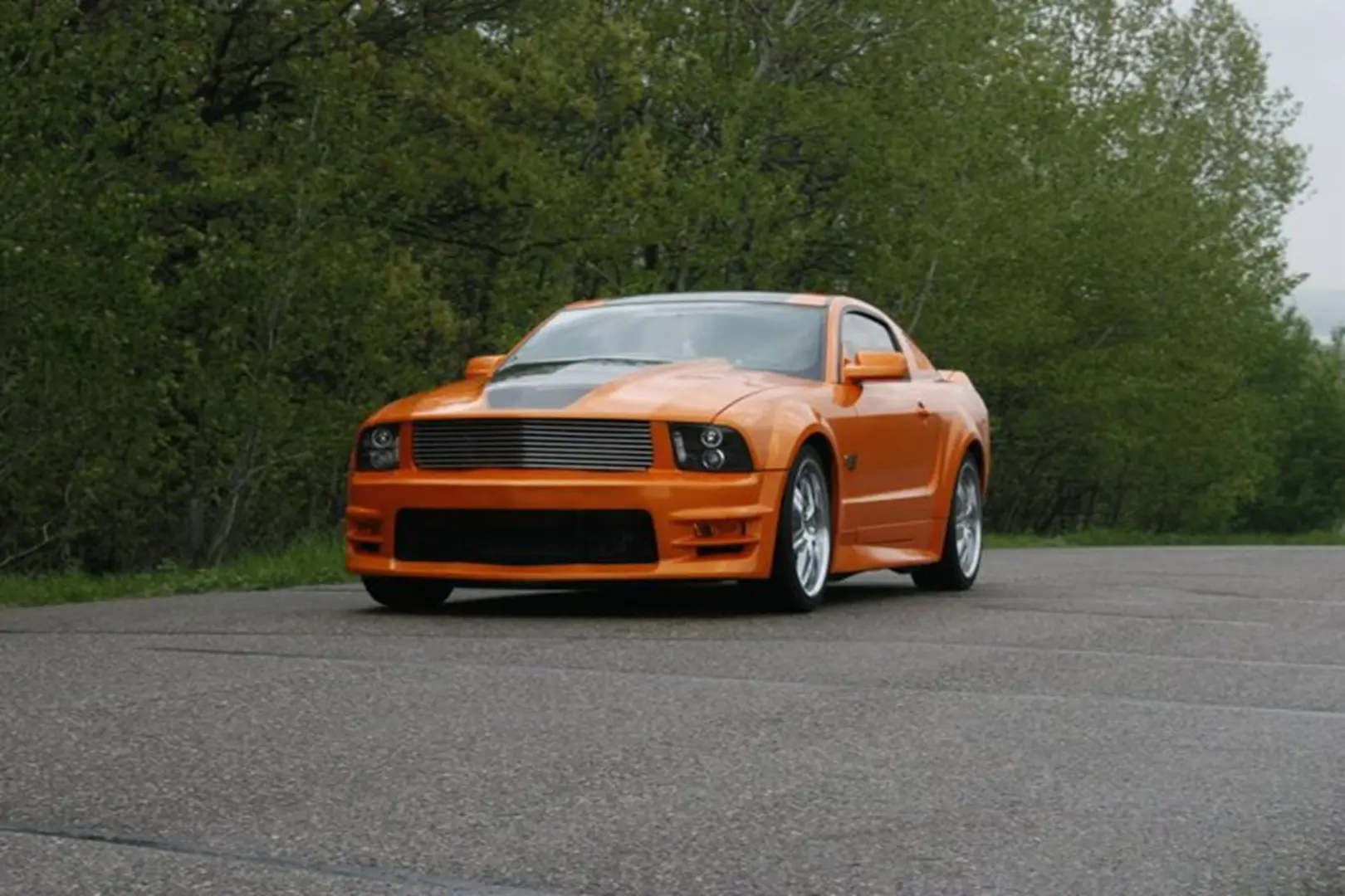 Bright orange car parked outdoors