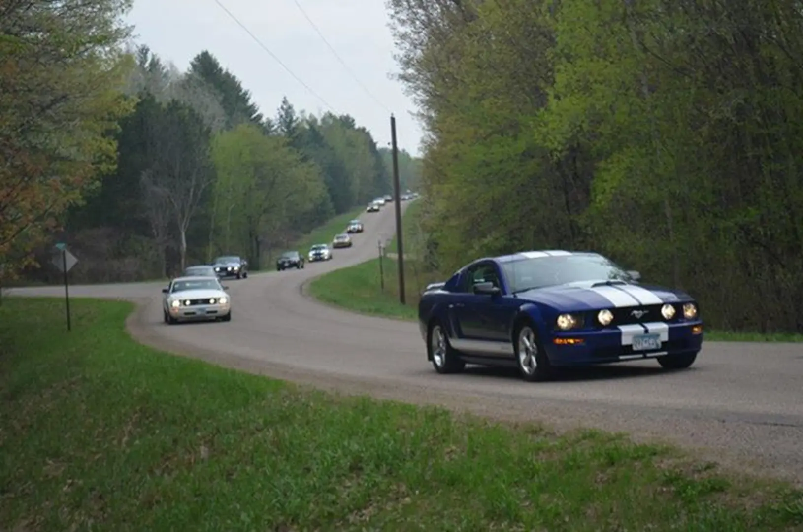 Blue car leading a scenic drive