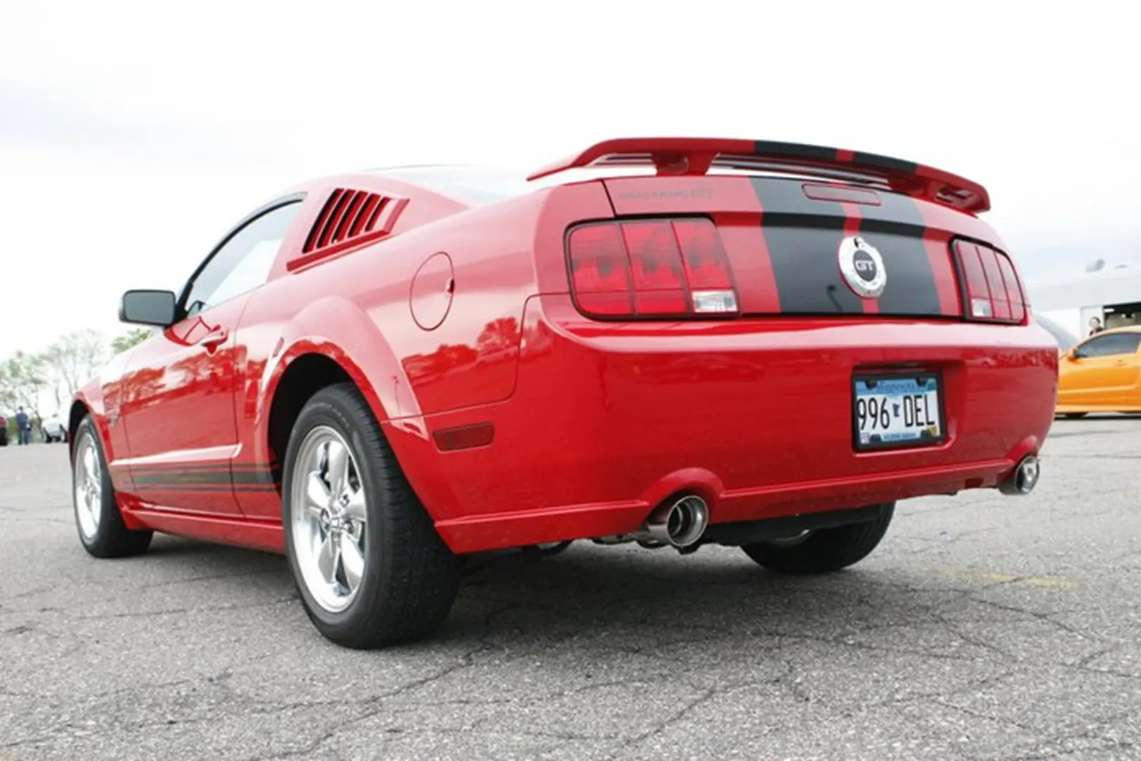 Red sports car with black stripes
