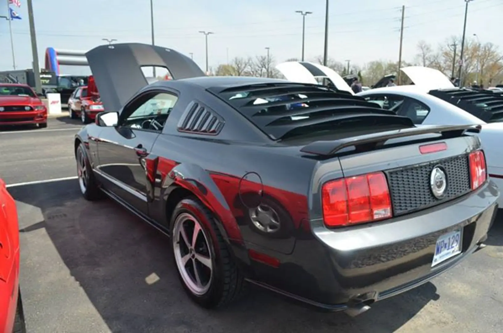 Parked sports car with open hood
