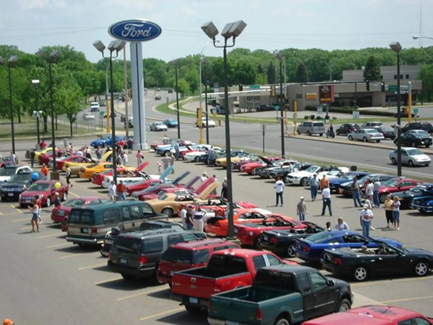 Car show at Ford dealership parking lot