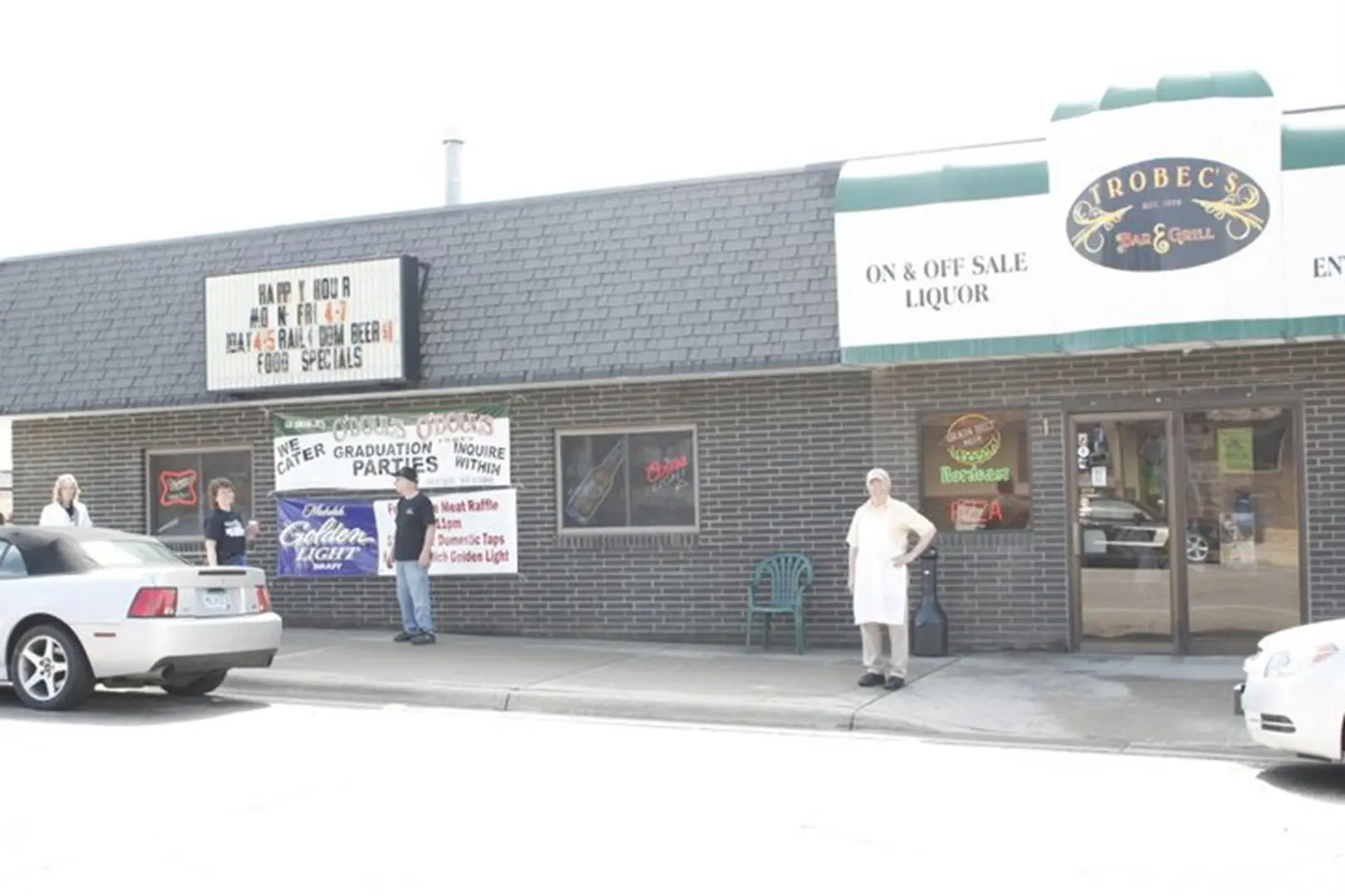 Liquor store with people outside