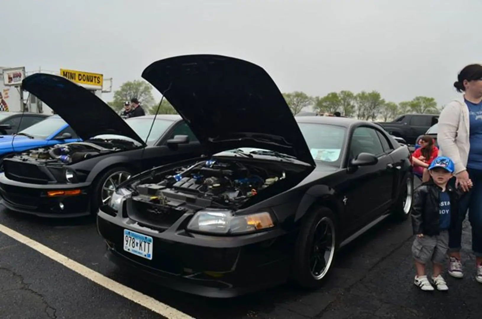 Black sports car with hood open
