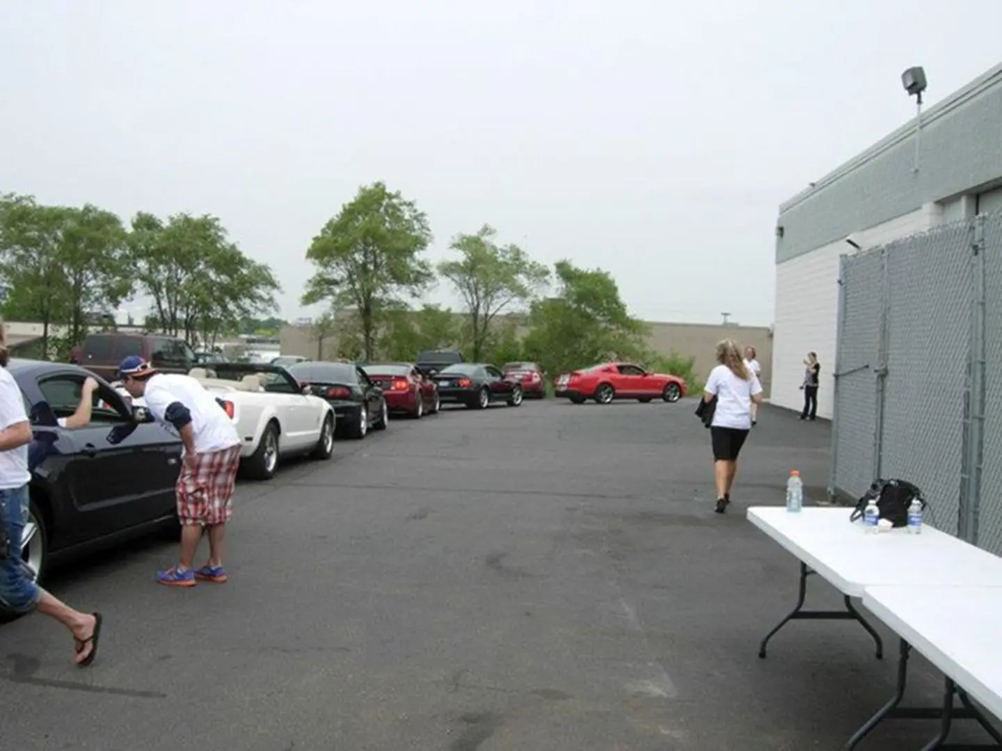People and cars in parking lot