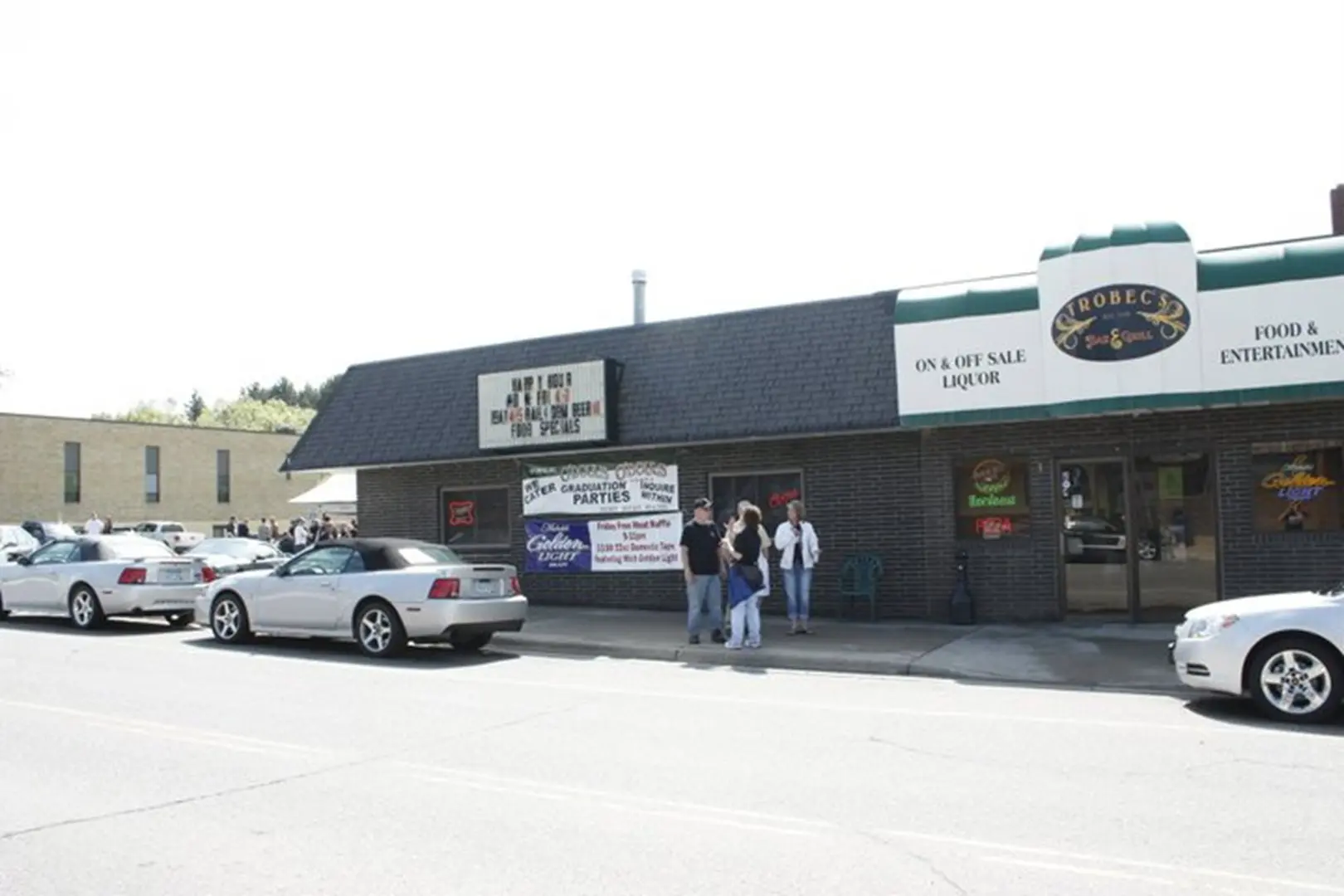 Cars parked in front of a restaurant