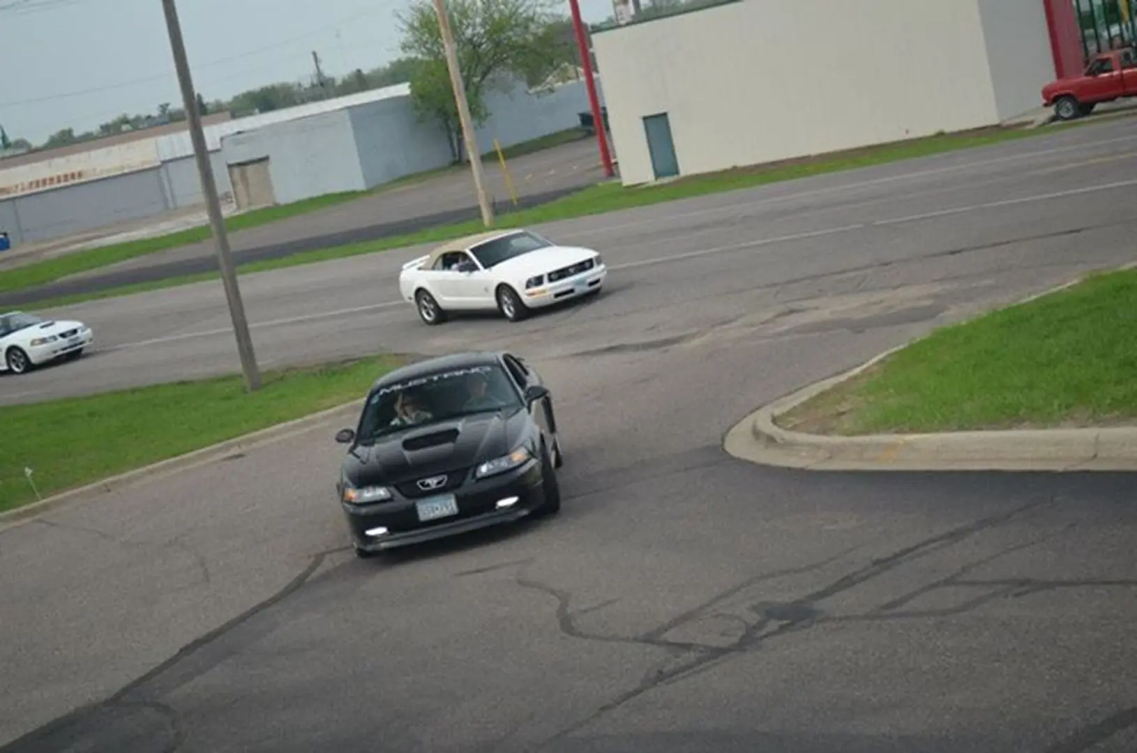 White car driving on road