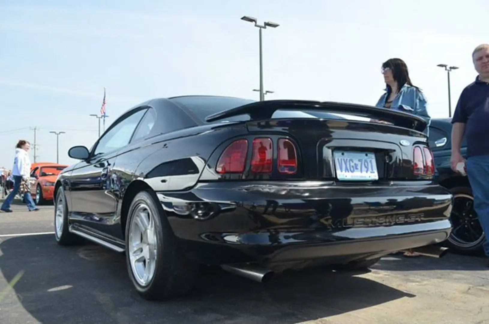 Vintage black car with spoiler displayed