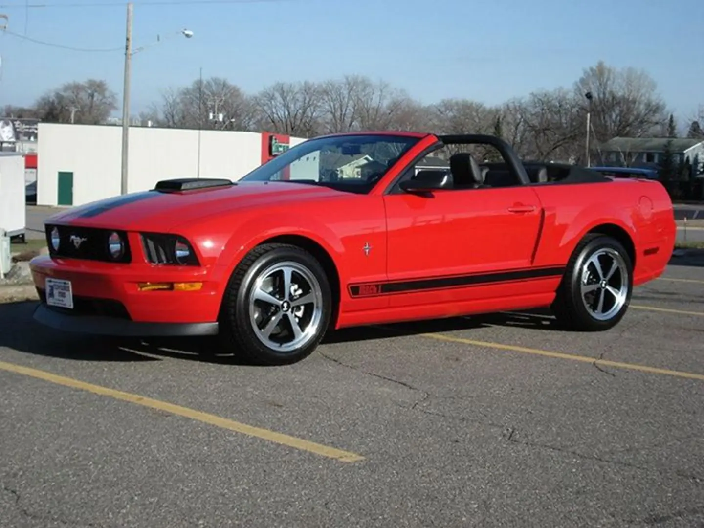 Red convertible sports car in parking lot