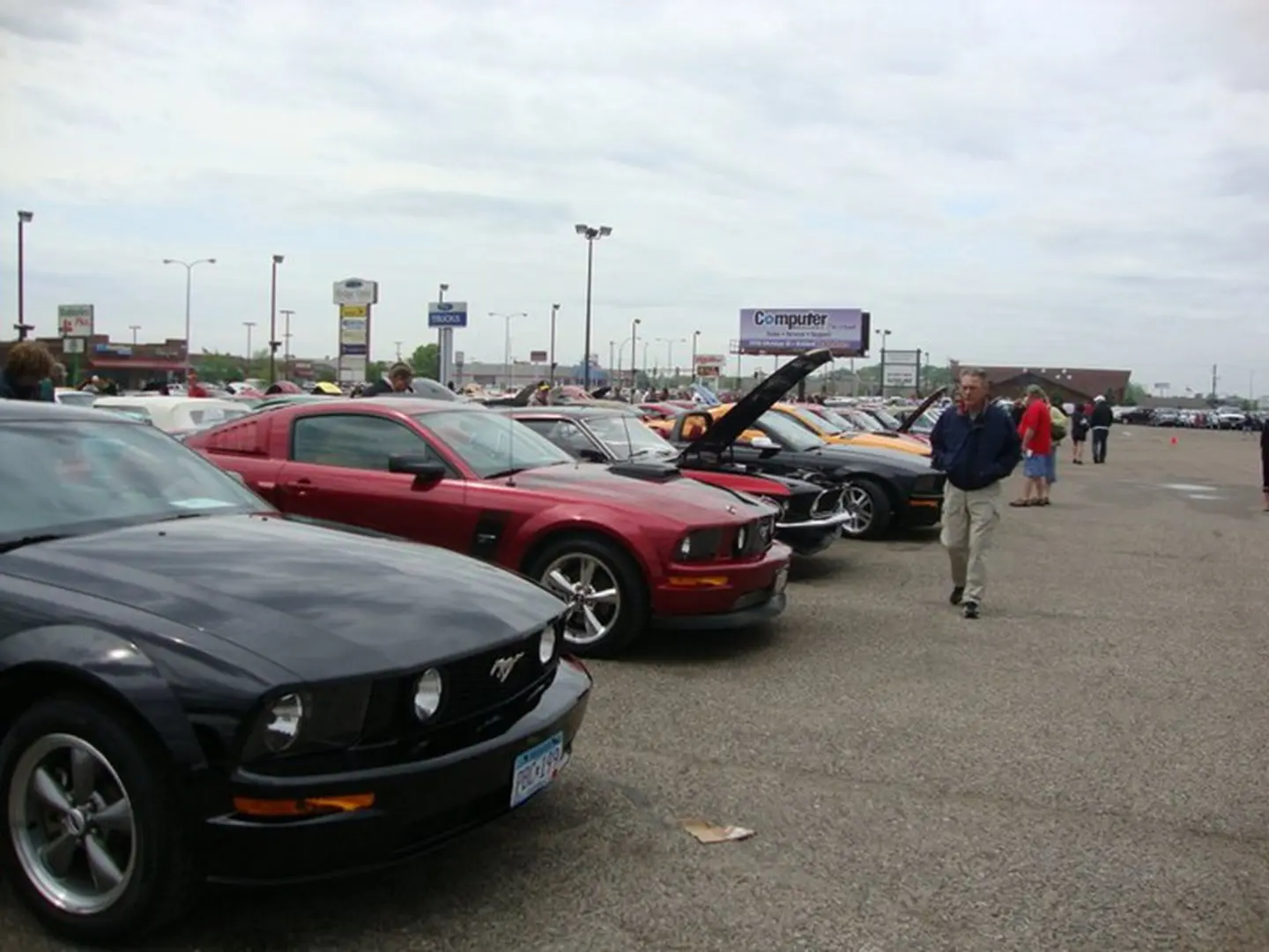 Outdoor car show with various models
