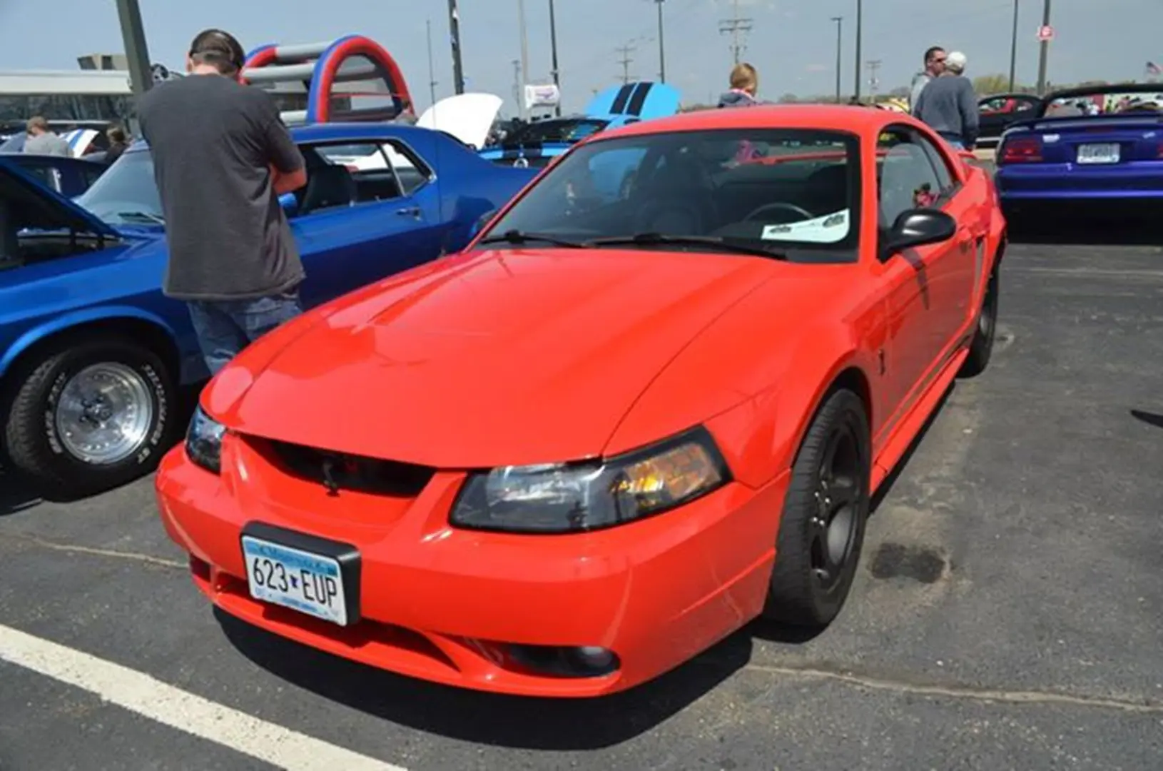 Red sports car at car show