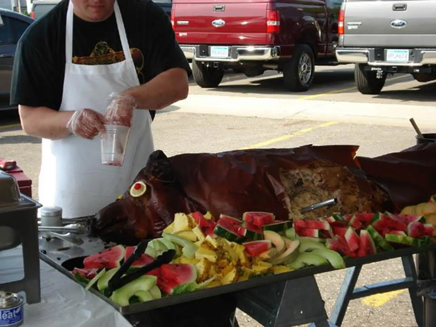 Outdoor barbecue with roast pig