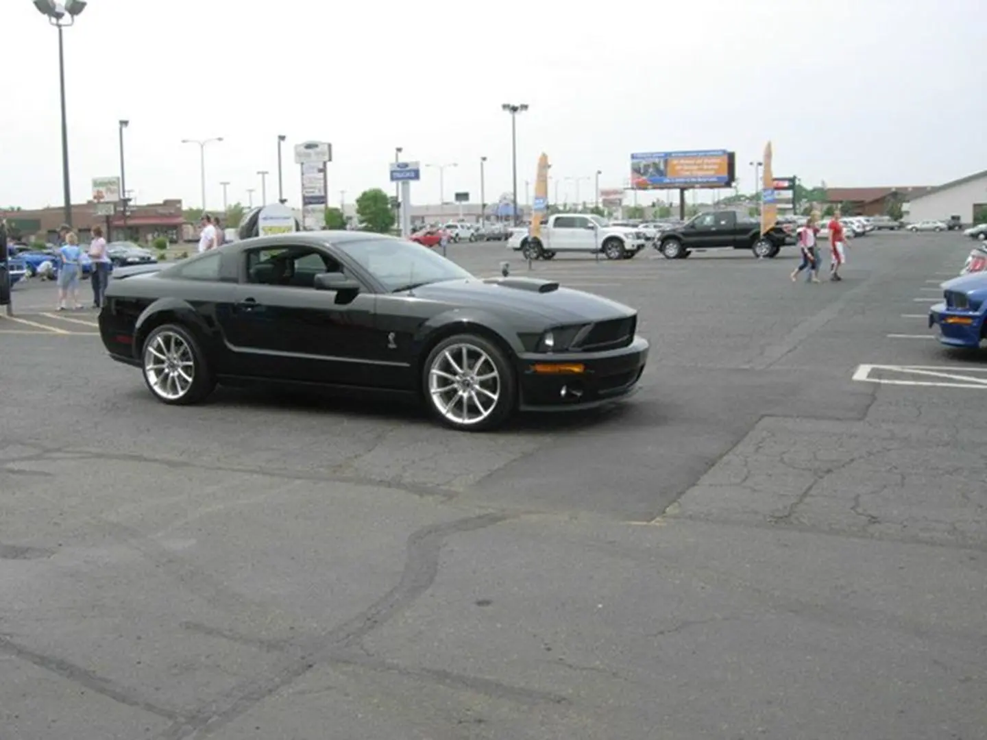 Black sports car in parking lot