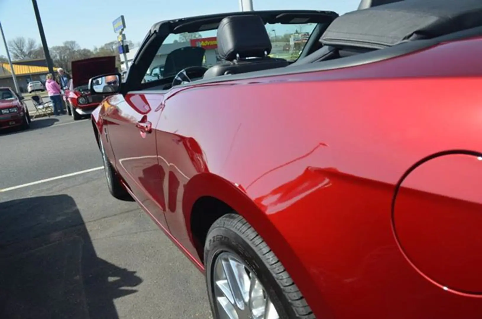 Convertible with top down in parking lot