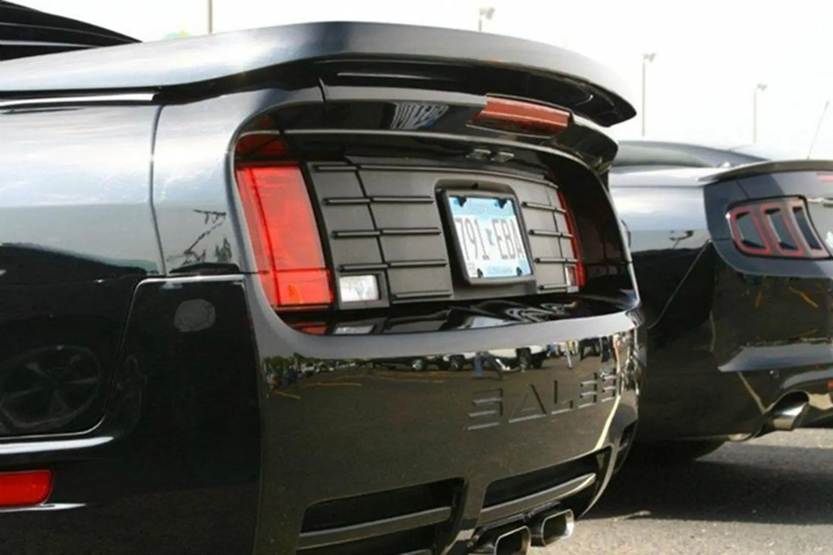 Black sports cars parked side by side