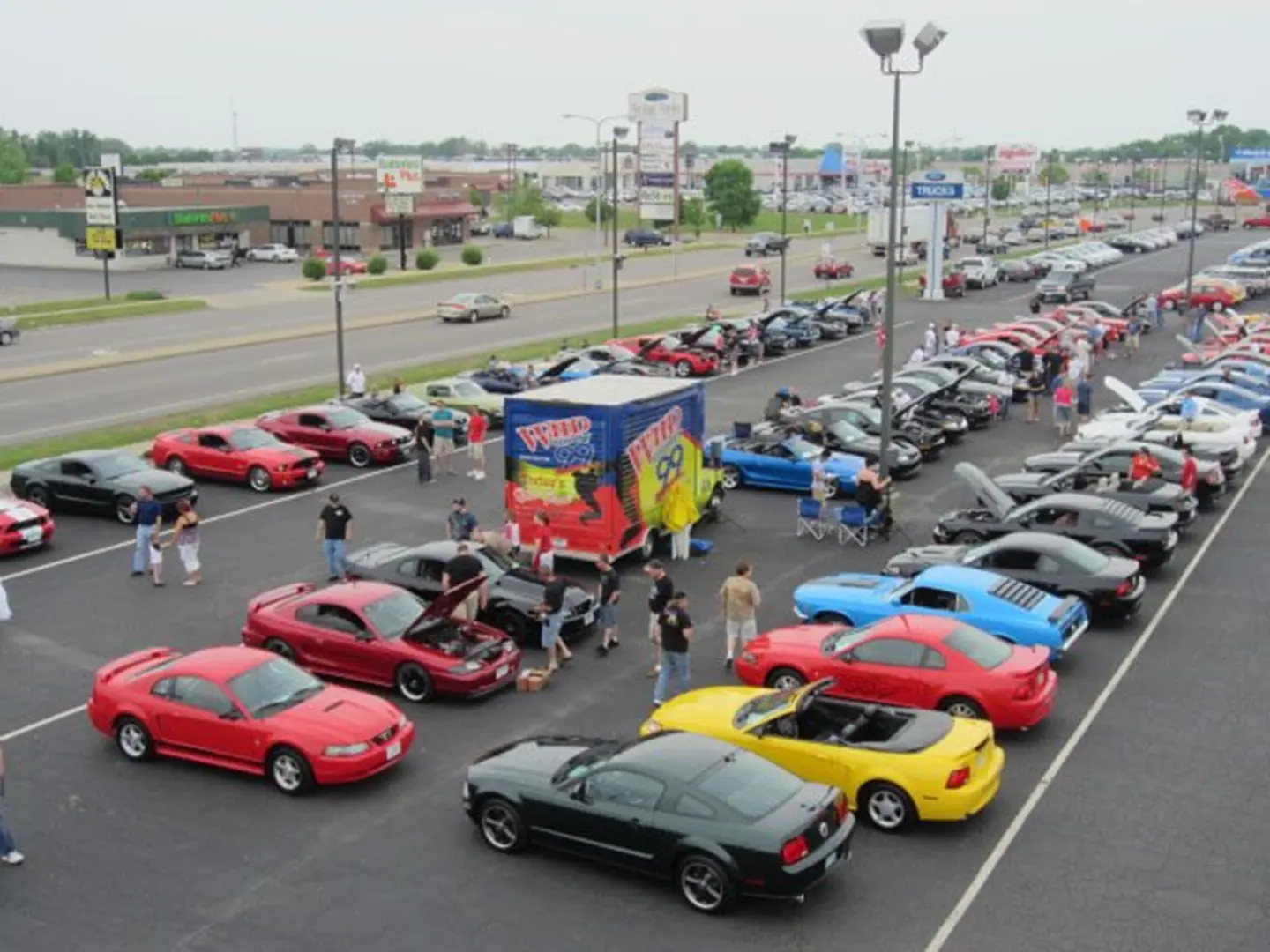 Car meet with diverse vehicles displayed