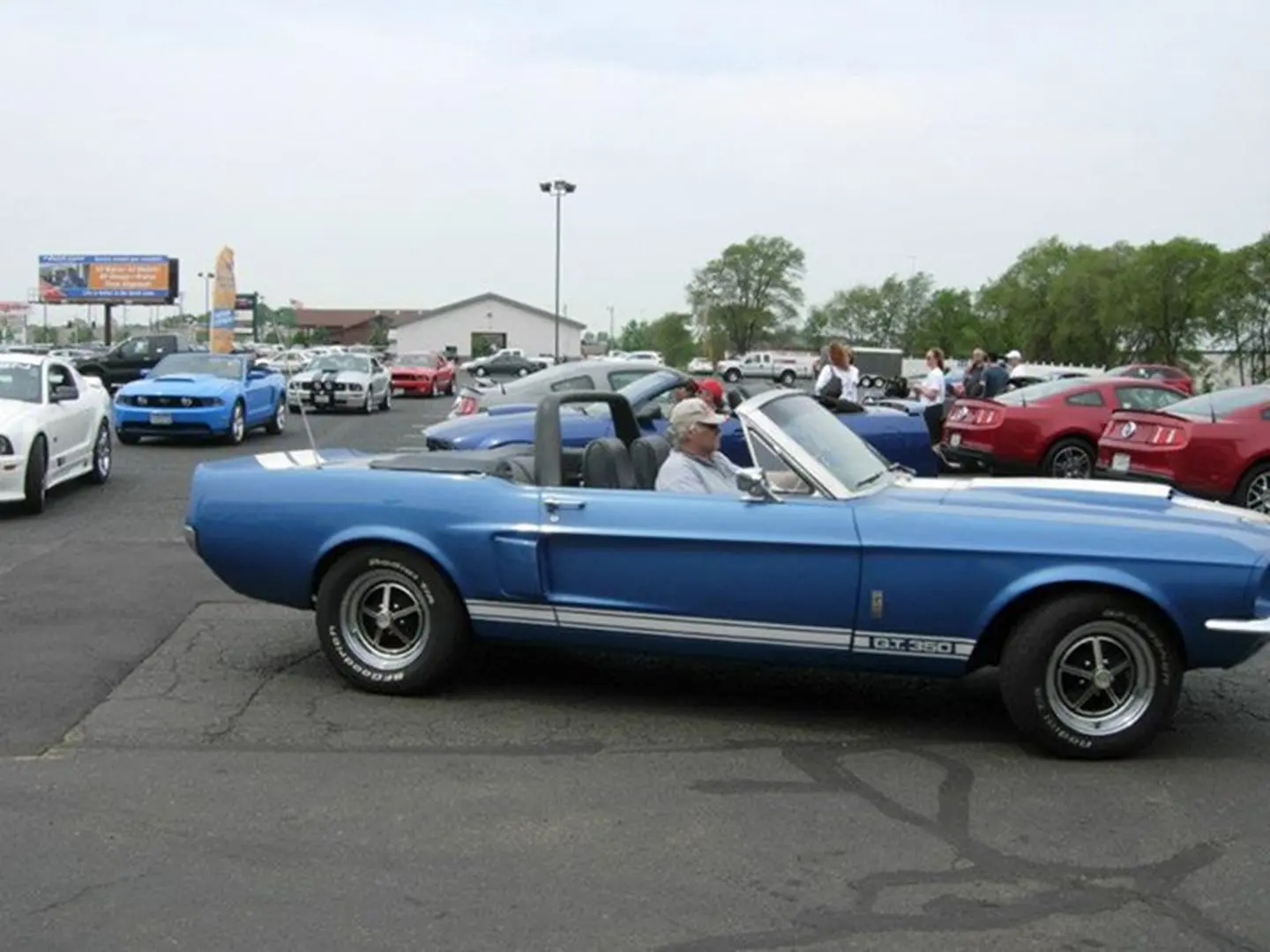 Blue vintage car in parking lot