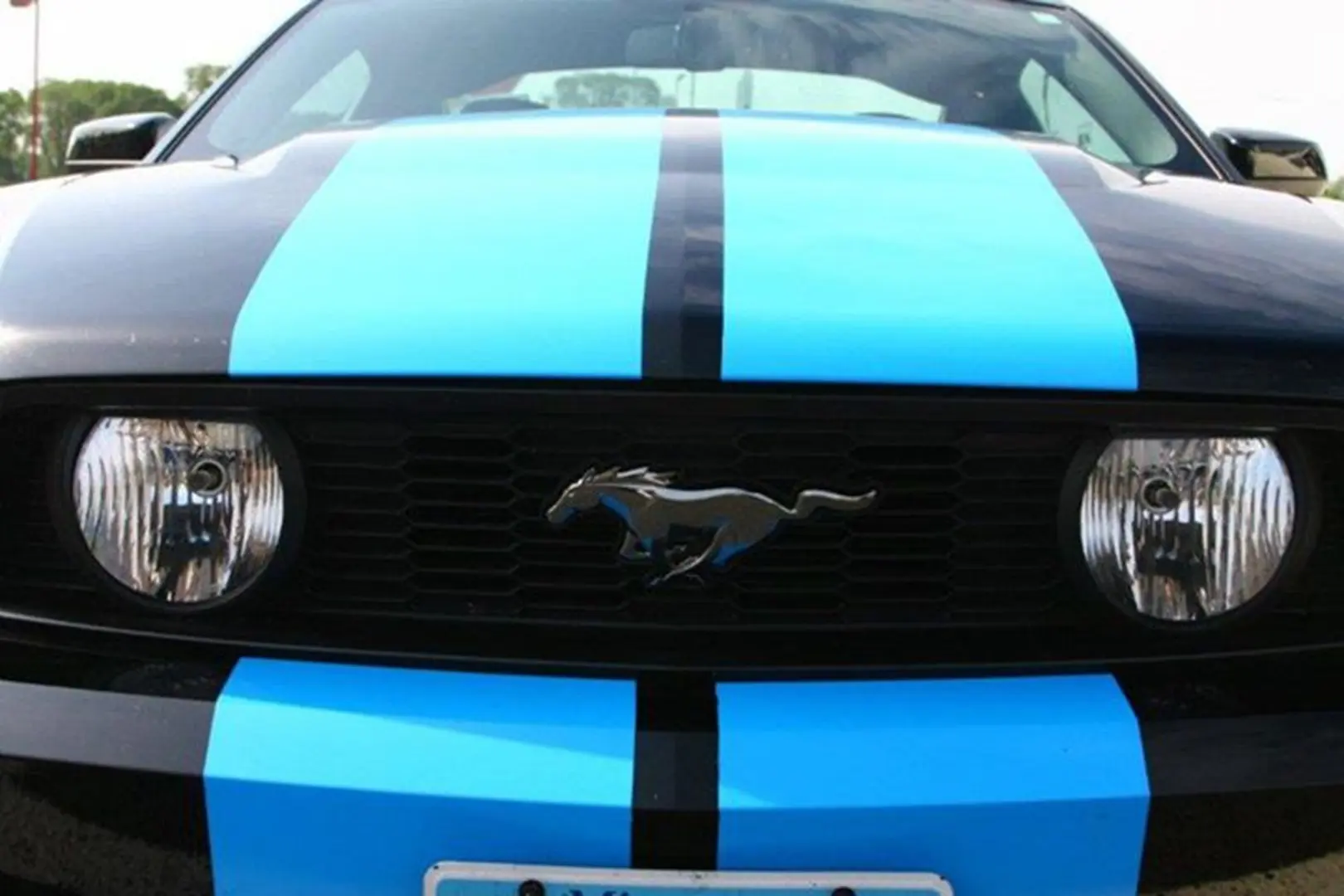 Classic car with iconic horse emblem