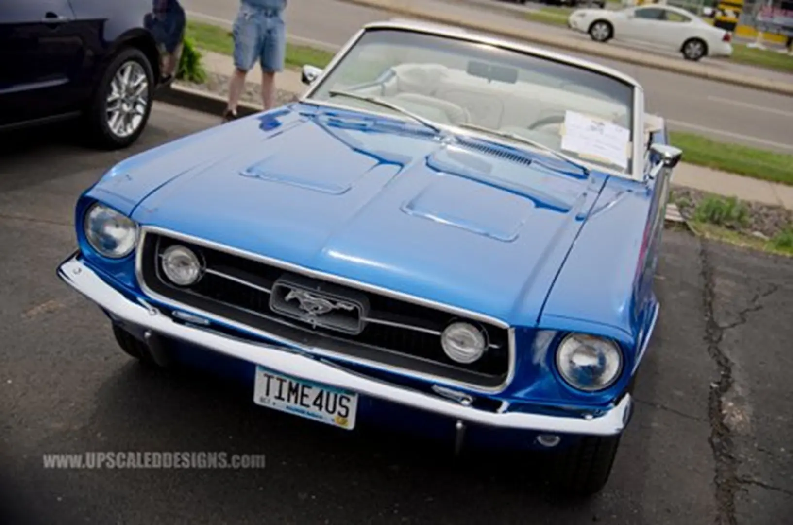 Shiny blue Mustang with custom plate