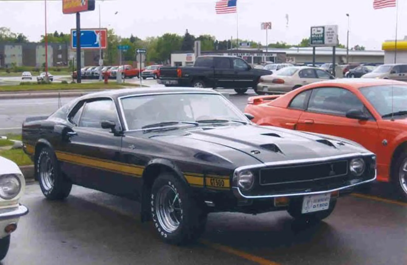 Vintage black muscle car in parking lot