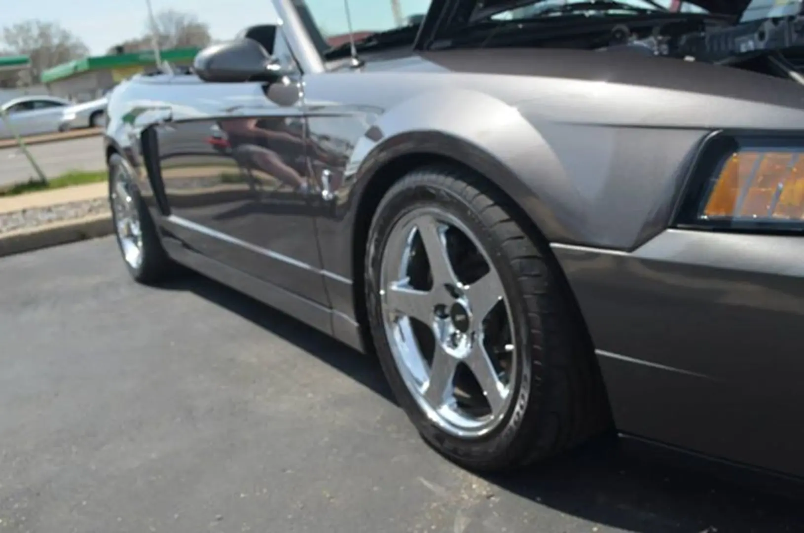 Convertible car parked on pavement