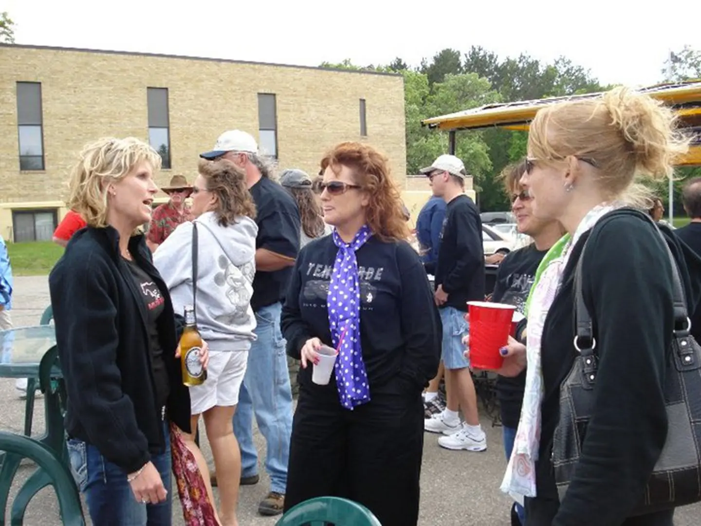 Friends chatting at an outdoor event