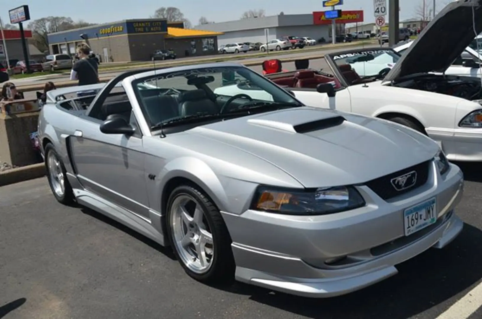 Classic silver Mustang parked on pavement