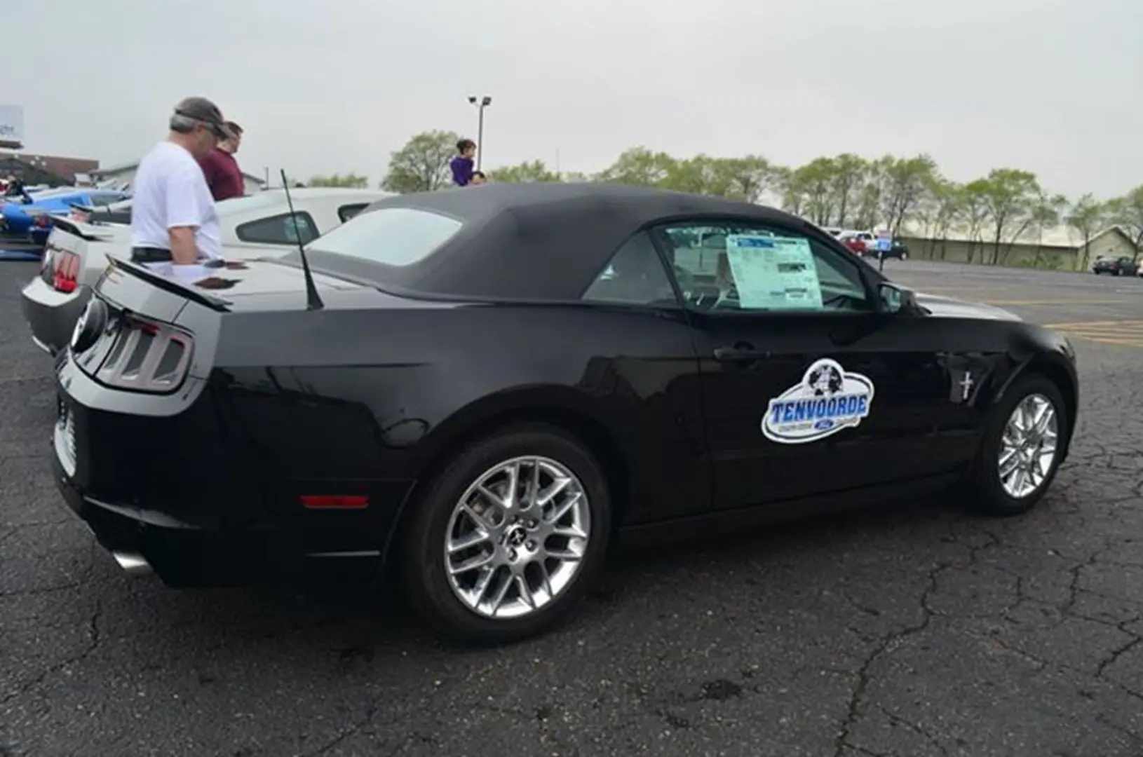 Classic black convertible with event sticker